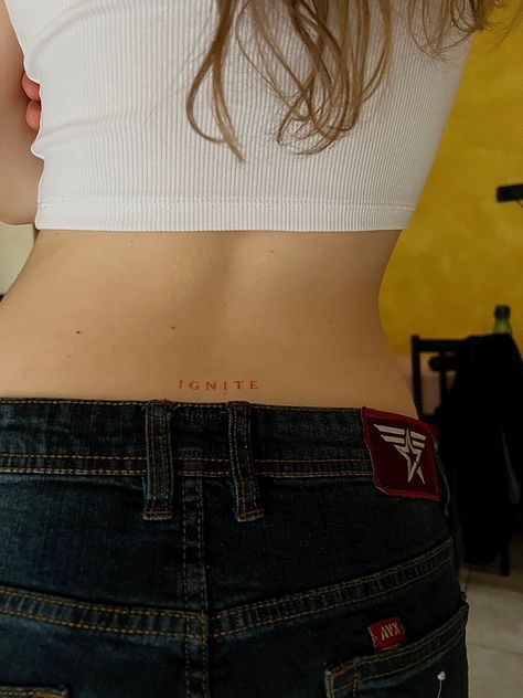 Minimal Lower Back Tattoo, Ignite Me Tattoo Aaron Warner, Lower Back Quote Tattoo, Ignite Tattoo Ideas, Shatter Me Tattoo Aaron Warner, Ignite Aaron Warner, Low Back Tattoo Women Words, Tramp Tattoos Lower Backs, Aaron Warner Tattoos