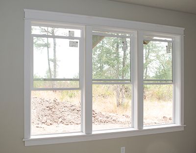 When Three Equals One: Trimming Three Windows with a Single Window Stool By Larry Walton Photos by Tim Walton When James and Michelle were designing their custom house on a great piece of property southwest of Eugene, Oregon, we talked about window designs, and how to incorporate active windows that can be … Wall With 3 Windows, Window Trim Ideas Interior Multiple Windows, 3 Windows In A Row Living Rooms, Trimmed Out Windows, Three Windows In A Row Exterior, Multiple Windows On One Wall, Sunroom Window Trim, Living Room Three Windows, Triple Window Living Room