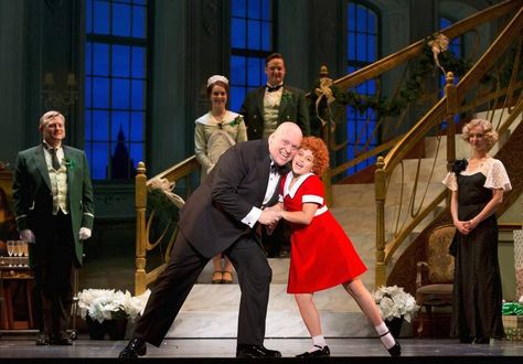 Oliver Warbucks (Gilgamesh Taggett) and Annie (Issie Swickle) sing about her impending adoption in the number "I Don't Need Anything But You" as butler Drake (Todd Fenstermaker, left) and secretary Grace Farrell (Ashley Edler, right) look on in the national tour of "Annie." The 1977 Broadway musical plays Chicago's Cadillac Palace Theatre through Sunday, Nov. 30. Annie On Broadway, Annie Musical, Broadway Costumes, Musical Plays, Theatre Costumes, Broadway Musical, Broadway Musicals, Tony Awards, Kids Events