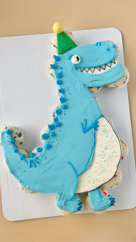 This Dino is ready to party 🦖🥳 . . . #pullapartcupcakes #pullapartcupcakecake #cupcakecake #pullapartcake #dinoparty #dinosaurcake… | Instagram Pull Apart Cupcake Cake Dinosaur, Dinosaur Birthday Cupcake Cake, Dino Birthday Cakes, Cupcake Cakes Pull Apart Dinosaur, Dinasour Cupcake Cakes, T Rex Pull Apart Cupcakes, Cupcake Cake Dinosaur, Dino Pull Apart Cupcakes, 3rex Birthday Cake