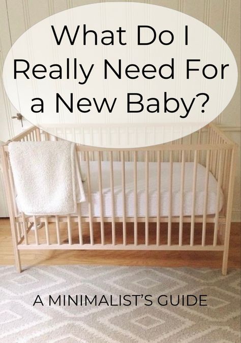 A crib made of natural wood with a cream blanket draped over the side. Nursery Ideas In Apartment, Minimalist New Mom Essentials, Simple Apartment Nursery, Loft Nursery Ideas Small Spaces, Nursery Room Essentials, Furniture For Nursery, Nursery Room Minimalist, Minimalist First Time Mom, Rental Friendly Nursery Decor