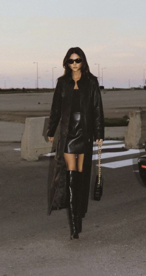 Nour Hammour Chic Outfit Ideas Classy, Pointy Knee High Boots Outfit, Long Black Leather Trench Coat Outfit, Knee High Pointed Toe Boots Outfit, Woman Sneakers Outfit, Louvre Outfit Ideas, Trench Coat Outfit Classy, Rich Winter Outfits, Dark Hair Outfits