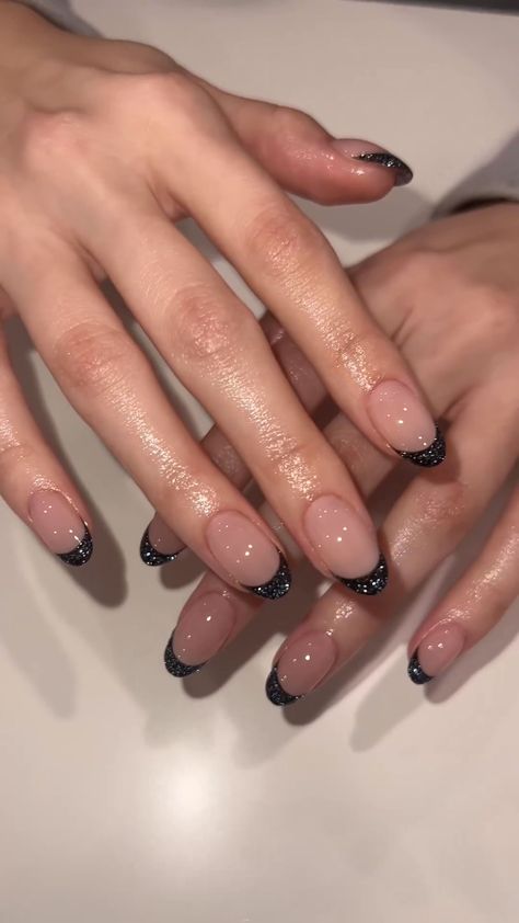 30 Best March Nails to Inspire You Black Hoco Nails Almond, Short Oval Nails Designs Black, Sparkly Black French Tip Nails Almond, Nail Inspo For Black Prom Dress, Black Sparkle Tip Nails, Black Reflective Nails, Black Sparkle Acrylic Nails, Black Chrome French Tip Nails, Glittery Black Nails