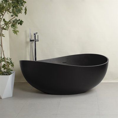 Enhance your bathroom with the elegant freestanding solid surface soaking bathtub, designed to blend seamlessly into any modern decor. Measuring 63"x37.4"x23.6", this bathtub boasts a sleek matte white surface that exudes both style and simplicity. Its solid, one-piece construction ensures both safety and durability, providing a long-lasting addition to your home. The freestanding design allows for easy and quick installation, making it a practical choice for any bathroom renovation. Ergonomical Black Bathtub, Contemporary Bathtubs, Stone Bathtub, Bathtub Doors, Acrylic Tub, Bathtub Design, Resin Stone, Freestanding Bathtub, Acrylic Bathtub