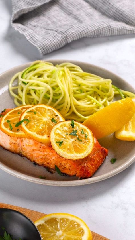 When you are looking for a delicious, restaurant-quality meal made easy, this recipe is for you. Salmon filets are smothered in a honey garlic butter sauce, topped with lemon and baked to perfection in about 15 minutes. Perfect for a weeknight meal. Recipe Teacher, Salmon Filets, Honey Garlic Salmon, Popular Dinner Recipes, Garlic Salmon, Garlic Butter Sauce, Fish Sea, Salmon Dishes, How To Cook Fish