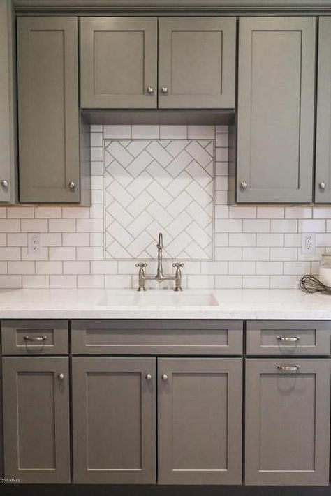 Top Hardware Styles To Pair With Your Shaker Cabinets | There’s nothing wrong with keeping it conventional. White Subway Tile Herringbone, Gray Shaker Cabinets, White Subway Tile Backsplash, Kabinet Dapur, Shaker Kitchen Cabinets, Herringbone Backsplash, Gray Cabinets, Classic Kitchen, White Subway Tile