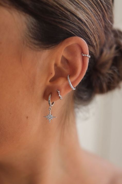 Create a gorgeous celestial inspired ear stack with Cartilage Cartel. Huggies, Hoops, Studs and Cuffs made with 925 Sterling Silver or 18 Carat Gold. #CELESTIALEARRINGS #CELESTIALJEWELERY #EARRINGS #EARSTACKING #CURATEDEARS #PIERCINGIDEAS Earring Inspo Silver, Earrings Aesthetic Silver, Silver Earring Stack, Summer Jewlery, Silver Earrings Aesthetic, Wishlist Board, Ear Stacking, Indian Queen, Earring Stacks