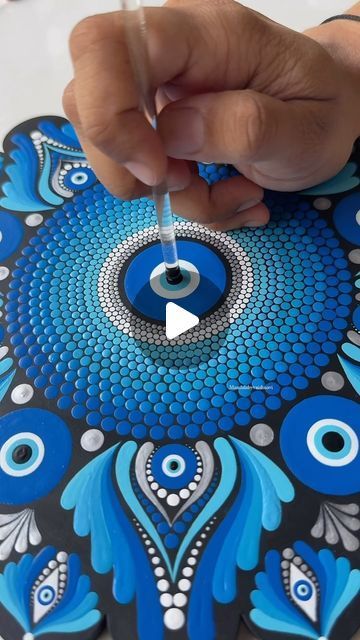 Vaishnavi | Mandala Artist on Instagram: "Embracing the power of the evil eye dot mandala. 🧿  This intricate design not only captivates with its beauty but also serves as a symbol of protection and good fortune. ✨  Each dot, each line, holds a deeper meaning, creating a shield against negativity. 🌟🧿   #mandalabyvaishnavi #mandala #dotmandala #evileyedotmandala #EvilEye #MandalaArt #evileyemandala #evileyeart #evileyemandalaart #trending #reelsinstagram #reels #trendingreels" Evil Eye Art, Symbol Of Protection, The Evil Eye, Deeper Meaning, Dot Mandala, Artist On Instagram, Good Fortune, Intricate Design, Crafty Ideas