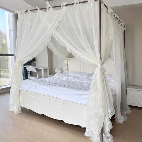 Enhance your bedroom's charm with our Luxurious Sheer Canopy, perfect for any four-poster bed. Crafted from high-quality, lightweight fabric, this canopy drapes elegantly over your bed, providing a soft, ethereal quality that transforms any sleeping area into a tranquil sanctuary. The beautiful white fabric is adorned with delicate ruffles along the edges, adding a touch of romance and sophistication to your bedroom decor. Designed for ease of installation, this canopy features ties at each corn Canopy Beds Vintage, White Bed With Canopy, Canopy Bed Frames, White Coquette Bedroom, Four Poster Bedroom Ideas, Vintage Canopy Bed, Cozy Bedroom White, Four Poster Bed With Curtains, Canopy Bed Aesthetic