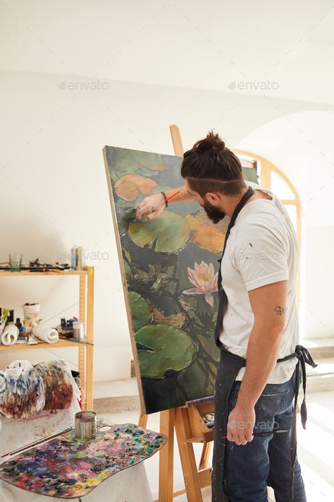 Modern Bearded Man Painting on Easel in Studio by seventyfourimages. Vertical back view portrait of talented male artist painting picture on easel while working in spacious art studio li... #Sponsored #seventyfourimages, #Studio, #Vertical, #portrait Men Art Photography, Man Artist Aesthetic, Man Drawing Aesthetic, Men Painting Aesthetic, Male Painter Photography, Male Artist Portrait Photography, Man Painting Aesthetic, Male Artist Photoshoot, Male Painter Aesthetic