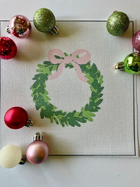 This Christmas wreath needlepoint canvas brings the holiday spirit to life in your home! Decorate as a door hanger or an ornament or give as a gift this holiday season. Personalize it with a letter to make it extra special!  The price listed is for an unfinished needlepoint design printed with high quality glicee-printed onto a 14-count mesh canvas. There is also the option to include color matched DMC embroidery floss.  The needlepoint canvas includes: canvas with applied artwork color coded th Needlepoint Door Hanger, Christmas Needlepoint Ornaments, Needlepoint Projects Ideas, Christmas Needlepoint Patterns, Needlepoint Ornaments Christmas, Needlepoint Wreath, Needlepoint Finishing Ideas, Needlepoint Letters, Needlepoint Alphabet