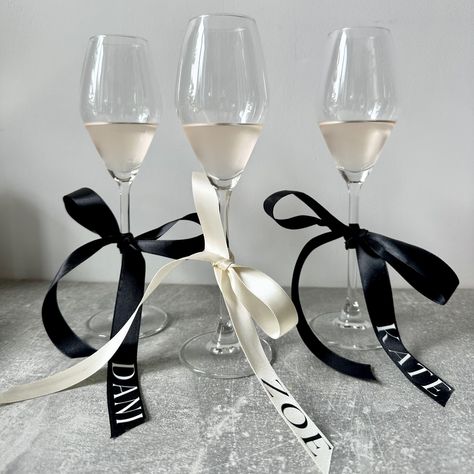 Another set of bows all sent out… These bows are already proving popular! Who else is loving the bow trend? I know I definitely am ( hint to my own wedding there 🙊 ) other colours optional of course just get in touch. Always on hand to help. X Wedding Dance Floor Accessories, Ribbon On Wine Glasses, Bow Name Cards, Black Tie Bridal Party, Dinner Party Name Cards, Bow Place Cards, Bow Dinner Party, Dinner Name Place Cards, Ribbon Name Tags