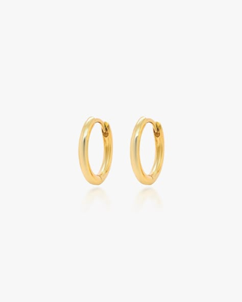 Say hello to our simple gold mini huggie hoops. The hoops are made in 14K gold fill, making them tarnish-resistant, waterproof, and safe for sensitive ears. Brandy Melville Gold Hoop Earrings, Mini Gold Hoops, Minimalist Vibe, Golden Hoops, Small Gold Hoops, Ear Party, Ear Pins, Mini Hoop Earrings, Jewelry Essentials