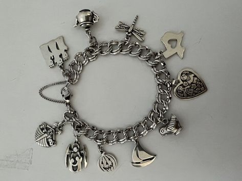 Beautiful 8” Light Double Curb James Avery Sterling Charm Bracelet Retired Teapot, Sailboat, etc.!. All 10 James Avery charms on the bracelet include the following: retired 3 Kings on a temporary jump ring, retired teapot on a temporary jump ring, dragonfly, Heart Texas, retired Love is on a temporary jump ring, retired Southwestern bird/chicken, retired sailboat, Jack-o-lantern on a temporary jump ring, guardian angel w/children on a temporary jump ring, retired Noah’s ark on a temporary jump ring. Rarely/gently worn. I used the temporary jump rings to be able to change out charms when I wanted to. Any James Avery store can easily permanently weld the charms to the bracelet if so desired. 10 total charms. *Will send signature required. James Avery Charm Bracelet, Pandora Bracelet Charms Ideas, 3 Kings, James Avery Charms, Bracelets Collection, Noah S Ark, Bracelet Charms, Pandora Bracelet Charms, James Avery