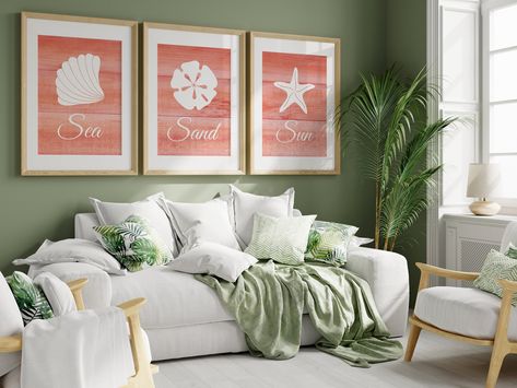 "Set of 3 wall art prints with nautical design, perfect match for coral and white wall decor for beach house, coastal living decor - Sun Sand Sea Sizing and material options are available from the drop-down menu. These high quality prints are created digitally and are beautifully printed on Photo Paper (UNFRAMED or FRAMED) and Canvas. The price listed is for the whole 3pc set. UNFRAMED PAPER PRINTS OPTION: -Printed on Luster Photo Paper for a more professional look. The surface of luster photo paper is also less likely to show fingerprints. -Frames and mats are NOT included, the prints will ship in flat rigid mailers or mailing tubes depending on the sizes. FRAMED ART PRINTS OPTION: -Printed on Archival Matte Fine Art Paper using Giclee method with Eco-solvent inkjet which creates an elega Coral Beach House, Decor For Beach House, Ocean Bathroom, Coastal Living Decor, House Coastal, Coral Beach, Home Themes, White Wall Decor, Guest Room Decor