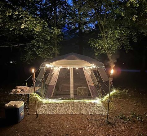 tent campsite with tiki torches Tent Camping Hacks Glamping, Cool Tent Campsite Setups, Camp Setup Ideas, Tent Hacks Camping, Romantic Tent Camping Ideas, Cozy Camping Tent Set Up, Glamping Set Up Ideas, Camping Tent Decor, Small Tent Set Up Ideas Inside