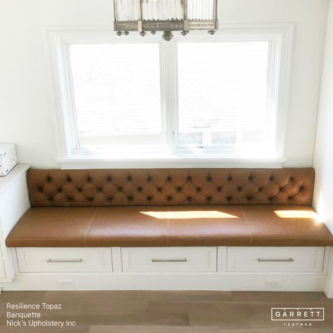 A stunning tufted banquette upholstered in our Resilience Topaz by @nicks_upholstery. Nick ensured the seat cushion was perfectly flush with the adjacent cabinets and that the back didn't extend over the window ledge. With the table and chairs now in place,this space is a perfect breakfast nook for cozy family dinners or entertaining guests. #garrettleather #nicksupholstery #interiordesign #banquette #kitchendining #leatherbanquette #breakfastnook #diningroom #leathercraft #leatherupholstery... Modern Banquette Seating, Leather Banquette Seating, Modern Banquette, Custom Banquette Seating, Tufted Banquette, Victorian Benches, Breakfast Nook Bench, Leather Banquette, Window Wrap