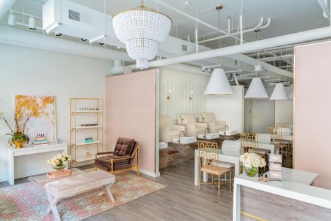 With a color palette of cream, blush and gold, this nail salon from M.A. Allen is both soothing and glamorous. Where upholstered armchairs provide comfortable seating for mani pedis, contemporary tables and an exposed ceiling create visual interest. Salons Cottage, Nail Salon Interior Design, Nail Salon Interior, Nail Salon Decor, Nail Salon Design, Salon Suites, Beauty Salon Design, Beauty Salon Interior, Beauty Salon Decor