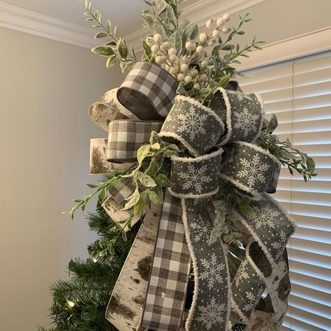 "Gray Buffalo Plaid/Check Christmas tree topper.  Christmas Tree Topper created with high quality designer wired 2 1/2 inch ribbon and frosted and snowy faux greenery featuring lambs ear, icy white berries. The ribbon patterns include beautiful birch bark; gray and white buffalo plaid/check; and gray ribbon with white, sparkling snowflakes and \"snowy\" chenille edging. If the tree will be viewed from all sides, purchase two for a complete all around look Finished size is approximately: 36 inche Snowflake Christmas Tree Topper, Christmas Tree Toppers Elegant, Farmhouse Buffalo Plaid Christmas Tree, Xmas Tree Ribbon Ideas, White And Grey Christmas Decor, White Farmhouse Christmas Tree, Rustic Farmhouse Christmas Tree Ideas, How To Put Ribbon On A Christmas Tree, Modern Farmhouse Christmas Tree Ideas