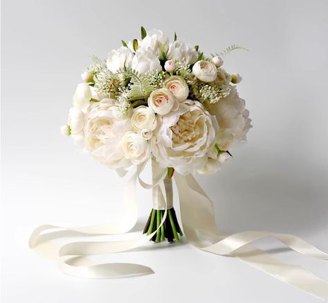 Elevate your special day with our Timeless Elegance White Bridal Bouquet, featuring meticulously crafted faux peonies and roses. This minimalist yet classic arrangement exudes sophistication, perfect for the discerning bride. Each flower is designed to maintain its pristine beauty, making it a timeless keepsake. Ideal for weddings that demand high-quality and refined decor. Enhance your ceremony with this luxurious touch, ensuring a memorable and elegant celebration. This exquisite faux bridal b Real Flowers Wedding Bouquet, White Rose Bridal Bouquet, Wedding Bridesmaid Bouquets, Ivory Bridal Bouquet, Anemone Bouquet, Ivory Bride, White Flower Bouquet, Bridal Bouquet Peonies, Artificial Wedding Bouquets