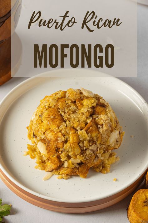 Mofongo is a popular Puerto Rican dish made with fried green plantains mashed with chicharrones (crispy pork skin) and garlic. Mafalda Recipes, Puerto Rican Avena Recipes, Puerto Rican Appetizers Parties, Empanadas Recipe Puerto Rican, Easy Mofongo Recipe, Puerto Rican Mofongo Recipe, Mofongo Puerto Rican, Easy Puerto Rican Recipes, Puerto Rican Recipes Rice