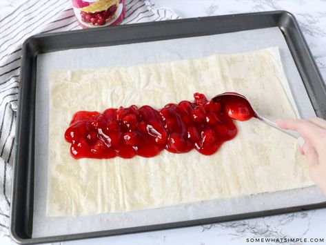 Easy Cherry Strudel Recipe (Flaky & Sweet) Somewhat Simple: This Cherry Strudel is so tasty nobody will believe it is so easy to make! Just a few ingredients stand between you and this flaky, sweet pastry! #baking #fruit Phyllo Strudel Recipes, Fruit Strudel Recipes, Phyllo Dough Recipes Strawberry, Phyllo Dough Recipes Dessert Cherry, Cherry Strudel Recipe Puff Pastries, Cherry Strudel Recipe Phyllo Dough, Phyllo Dough Recipes Dessert Fruit, Cherry Puff Pastry Dessert, Cherry Puff Pastry Recipes