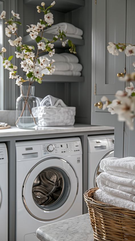 Elevate your laundry room from functional to fabulous with our curated collection of 44 elegant laundry room ideas that exude timeless style and sophistication. Dive into a world of chic design elements, luxurious finishes, and clever organizational solutions that will transform your laundry room into a space you'll love spending time in. White And Gray Laundry Room, Gray Laundry Room Ideas, Gray Laundry Room Cabinets, Chic Laundry Room Ideas, French Laundry Room, Gray Laundry Room, Chic Laundry Room, Elegant Laundry Room, Storage Laundry Room