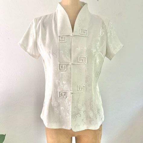 Very Classic And Sophisticated Asian Chinese Style Blouse Top W/ Mandarin Collar And Rope Button Closures. Pretty Ivory Floral Pattern With Subtle Silver Shine 100% Polyester, Unlined Very Slight Shoulder Pads (Removable) Size:Xl Tagged But Seems More Like M To L Modern Day Measurements. B:19.5” W:17” L:23” Mandarin Collar Pattern, Neutral Tops, Style Blouse, Collar Pattern, Mandarin Collar, Blouse Top, Chinese Style, Silk Blouse, Vintage Tops