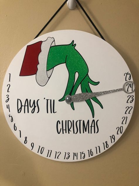 "25 Days 'til Christmas Grinch countdown wall hanger! Grab this 14\" interactive countdown round for the little ones this Christmas. The door hanger features a moveable \"wand\" that circles the number of days left until Christmas.  This is perfect for the little ones to move every day to countdown! *NEW* option!! Add a Grinch bow for a little added flare! Select the \"bow or no bow option\" below." Grinch Bow, Grinch Door, Grinch Christmas Party, Cricut Christmas Ideas, Grinch Christmas Decorations, Christmas Chalkboard, Christmas Grinch, Custom Christmas Gifts, Winter Wonderland Christmas