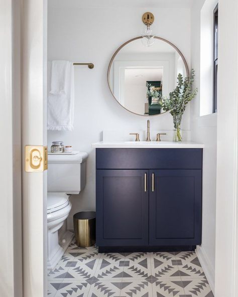 navy blue bathroom cabinets in boho bathroom with patterned tile and white countertop credit: Kimberlee Marie Small Guest Bathroom Ideas Half Baths, Scandinavian Bathroom Design Ideas, Small Guest Bathroom Ideas, Modern Powder Rooms, Navy Blue Bathrooms, Blue Cabinet, Blue Bathroom Vanity, Guest Bathroom Small, Bilik Air