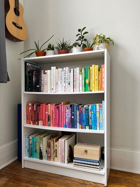 Bookshelf Colour Coded, Room Book Shelf Aesthetic, Cube Bookshelf Aesthetic, Aesthetic White Bookshelf, Small Book Shelf Ideas Bedroom, Bookshelf Color Organized, Aesthetic Room Bookshelf, Colour Coded Bookshelf, Aesthetic Small Bookshelf