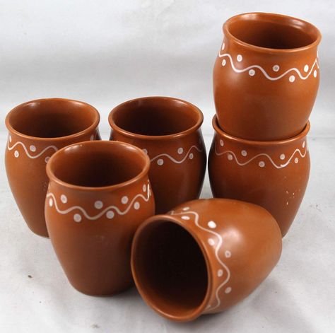 About this item
Hand crafted by rural artisans of Puri,Odisha
Color - Brown
Capacity - 160 ml each; Size in Inches ( Dia x H ) - 2 x 3
Set contents - 6 Ceramic cups
Care instructions : Wash with normal detergent by hand Holi Ideas, Hot Chai Tea, Indian Chai Tea, Indian Ceramics, Indian Chai, Mexican Party Decorations, Dinning Set, Pottery Painting Designs, Brown Ceramic