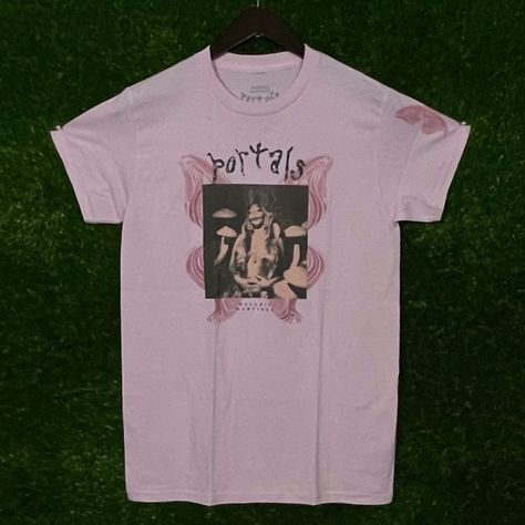 Urban Outfitters' Melanie Martinez Portals Rock T-Shirt, Size Medium, 17 Inches Pit To Pit, 26 Inches Length, In Pink. Urban Outfitters Brand Melanie Martinez Design Portals Rock Theme Medium Size 17 Inches Pit To Pit 26 Inches Length Pink Color Comfortable Fit High-Quality Fabric Machine Washable Casual Style Perfect For Fans Limited Edition Size: Womens Medium Condition: New Without Tags Melanie Martinez Design, Melanie Martinez Shirt, Melanie Martinez Merch, Melanie Martinez Portals, Rock T Shirt, Tour Merch, Rock T Shirts, Birthday List, Melanie Martinez