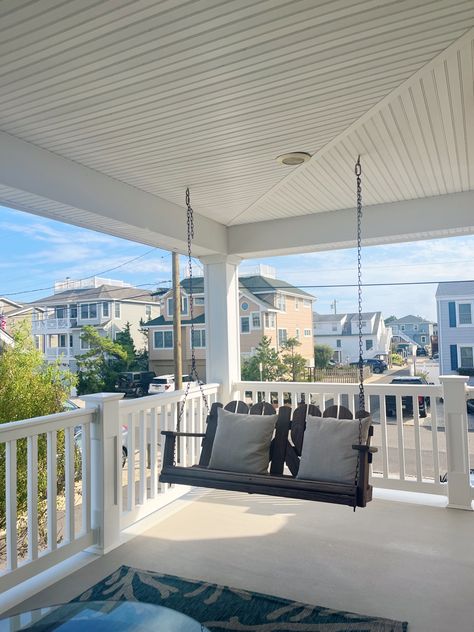 home inspo, home decor, summer house, hanging bench, beach house, LBI, NJ, porch decor, porch inspo, blue ans white carpet, bench with pillows, glass table, beach haven, white fence, white, blue, coastal grandmother, blue and white aesthetic, beach decor, summer, beach vibes, summer vibes, summer 2023, july, august, july 2023, august 2023, coastal granddaughter Hydrangea Beach House, Tsitp Beach House Aesthetic, Aesthetic Beach House Interior, Beach House Back Porch, Hamptons Beach House Aesthetic, Lbi Beach House, Costal Granddaughter Aesthic Living Room, Coastal Grandma House Aesthetic, Costal Aesthetic House