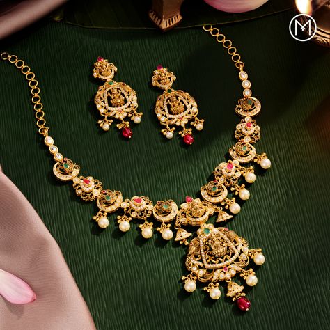 Witness a glimpse of Indian heritage carved in gold, complemented by pearls, gemstones and diamonds in this gorgeous jewellery set. Visit a store near you to explore more such jewellery. #MalabarGoldAndDiamonds #AkshayaTritiya #GlowOfGold Malabar Jewellery, Jewellery Shoot, Photography Set Up, Akshaya Tritiya, Gold Necklace Indian, Antique Bridal Jewelry, Necklace Indian, Flat Lays, Indian Heritage