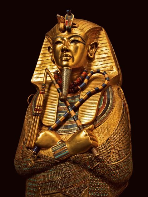 This coffin of solid gold is covered with incised decorations and inscriptions inside and outside, with the names and epitaph of the deceased king and protective texts. It is inlaid with semiprecious stones and colored glass. The coffin’s shape is that of Osiris holding the sacred insignia, the heka scepter and the flail. The vulture and the uraeus, or rearing cobra, protect his forehead. The divine beard is made of gold inlaid with blue glass. Deities of Upper and Lower Egypt protect. King Tut Tomb, The Boy King, Egypt Museum, Amenhotep Iii, Ancient Egypt Art, Egypt History, Valley Of The Kings, Egyptian Mythology, Egypt Art