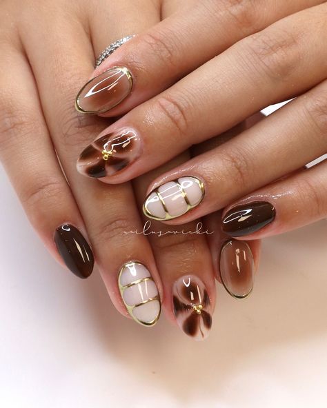 If brown isn’t a fall staple then idk what is 🍂🤎 . . #nails #nailusa #nailart #naildesign #nailsofinstagram #naildesigns #nailsoftheday #naildesignsideas #gel #gelnails #raleigh #durham #nailinspo #raleighnailtech #ncnails #raleighnails #raleighnailtech #trend #trendynails #BIAB #springnails #BIABnails #summernails #naturalnails #raleighgelx #gelx #gelxnails #fallnails Brown Nails Blooming Gel, Brown 3d Nails, Brown Blooming Gel Nails, 2025 Nails, Blooming Gel Nails, Concert Nails, Blooming Gel, Brown Nails Design, Abstract Nail Art