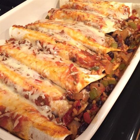 Black Bean and Rice Enchiladas | "This recipe is amazing! We recently went meatless and this is one of our favorite dishes! You don't miss the meat, it's filling, and low cal." Rice Enchiladas, Brown Rice Recipes Healthy, Black Bean And Rice, Healthy Brown Rice, Bean And Rice, Vegetarian Casserole, Black Bean Enchiladas, Vegetarian Enchiladas, Black Beans And Rice