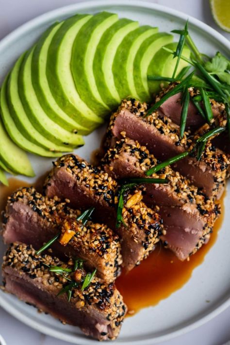 Make restaurant-style seared tuna with a delicious soy dipping sauce. Learn how to perfectly sear ahi tuna with a crunchy sesame seed crust. Cooked rare. #appetizer #dinner #quickandeasy #searedtuna #ahituna #sesametuna Seared Ahi Tuna Recipe, Seared Tuna Recipe, Sesame Tuna, Ahi Tuna Steak Recipe, Tuna Appetizer, Sesame Crusted Tuna, Ahi Tuna Recipe, Appetizer Dinner, Ahi Tuna Steak