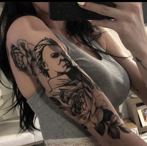 Mike Myers Tattoo, Michael Myers Tattoo With Flowers, Horror Sleeve Tattoos For Women, Michael Myers Leg Tattoo, Micheal Myers Tattoo, Traditional Michael Myers Tattoo, Micheal Myers’s Tattoo, Michael Myers Tattoo, Myers Tattoo