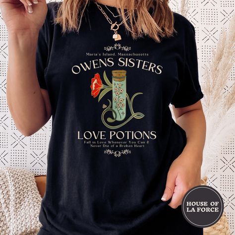 "\"Owens Sisters Love Potions\" Practical Magic Inspired Shirt  -Printed in green on the white and natural shirts :: GARMENT INFO :: - 100% Soft cotton (fibre content may vary for different colors) - The sleeves are rolled up for display purposes only :: SIZING :: - The Unisex sizing makes the shirt run larger than your average t-shirt (for women). We suggest ordering a size smaller than what you would normally wear. The shirts run true to size for men. - Please check out our size chart for meas Practical Magic Fashion, Modern Day Witch Outfit, Practical Magic Movie, Sara Fashion, Love Potions, Sisters Love, Cute Fall Shirt, Basic Witch, Witch Outfit