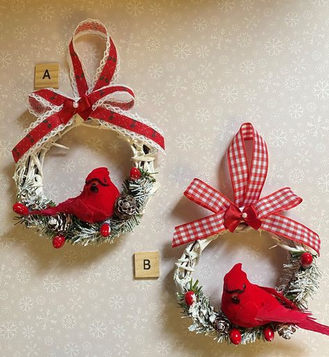 PLEASE READ FULL DESCRIPTION, POLICIES, AND VIEW ALL PICTURES. These are sold individually.  These are brand new Cardinal Christmas ornaments ready for you to hang on your tree! These 4 inch grapevine wreathes are hand painted and decorated with artificial pine, real mini pine cones, red pip berries, and a beautiful red Cardinal; the ornaments are accented with a beautiful Christmas ribbon and artificial snow. Ornament A has a vintage ribbon while Ornament B has a new ribbon. Measures 4 - 5 inch round. One of these ornaments would look lovely on any themed tree - Traditional, Country, Rustic, Woodland....any tree!  Consider this as a gift for someone who loves birds or cardinals! Thanks for looking and stopping by HolidayByGrace! Red Cardinal Christmas Tree Bird Ornaments, Cardinal Christmas Ornaments Diy, Christmas Ribbon Ornaments, Small Grapevine Wreath Ideas, Cardinal Christmas Tree Ideas, Cardinal Ornament Diy, Grapevine Ornaments, Cardinal Crafts, Country Ornaments