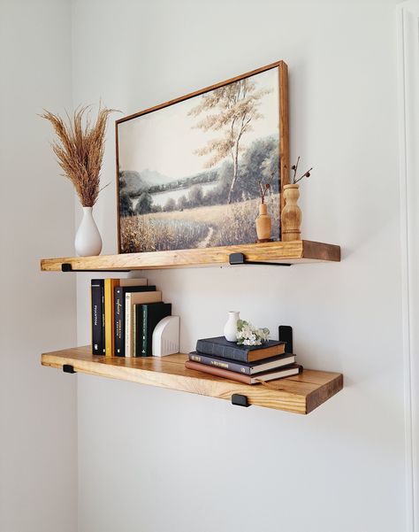 Our floating shelves would make a beautiful addition to any room in your home. Use them to display art, plants, pictures, books and so much more. Each shelf is handmade in our workshop, stained in the color of your choice and finished with two coats of polyurethane, ensuring that they will last for years and years to come. You will receive ONE solid wood shelf,  two heavy duty black J brackets, screws, drywall anchors and instructions to hang your shelf. If you have any questions, do not hesitat Basement Wall Shelving, Floating Shelf In Dining Room, Modern Dining Room Shelves, Living Room Wall Mounted Shelves, Big Picture With Floating Shelves, Minimalist Floating Shelf Decor, Plant Floating Shelves, Floating Wood Shelves Living Room, Floating Shelves Above Dresser