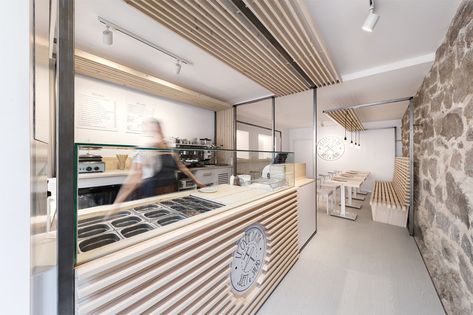 Erbalunga estudio have designed a creperie in Spain that combines original old stone, and new modern design elements. #Creperie #Cafe #RetailDesign #WoodSlats Creperia Ideas, Wood Bar Top, Interior Design School, 카페 인테리어 디자인, Cafe Interior Design, House Restaurant, Restaurant Interior Design, Commercial Interior Design, Wood Doors Interior