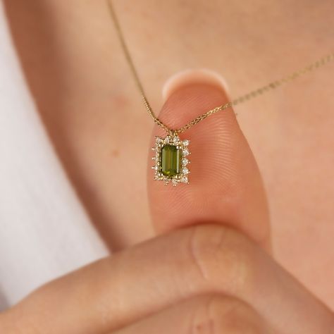 "Peridot stone is a stone that provides access to the body and mind. Positive thinking gives a feeling of optimism. Our Rectangle Peridot necklace surrounded by 14K Solid Gold diamonds is an elegant jewel for you and your loved ones with its elegant design. Time to pamper yourself and your loved ones... Peridot is the birthstone of August. 🤍🤍 Special gifts for your special moments. We produce our jewelery for you in the most perfect way. 🤍🤍 All of our products are made of 14K solid gold and Necklace Rectangle Pendant, Jewelry For Anniversary, Peridot Pendant Necklace, Peridot Gold Necklace, Peridot Jewelry Necklaces, Peridot Necklace Gold, Gold Stone Necklace Designs, Minimalistic Necklace, Birthstone Necklace Mothers