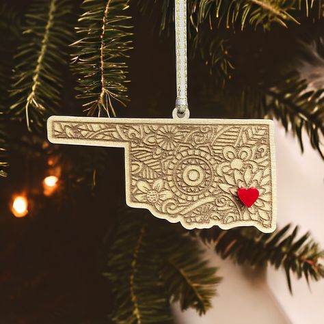 Celebrate your love for Oklahoma with our state pride ornaments. Our wooden, laser-engraved state ornaments are the perfect wedding destination favors as all fifty states are available. Add an optional red or pearl white heart around the city of your choosing. Each ornament can be engraved with a short message on the back and can be placed in a gift bag with our logo on the tag or your custom logo/name, etc. Featuring a beautiful mandala pattern, our Oklahoma Christmas ornament adds a touch of elegance to any holiday decor.  These Sooner State ornaments can be used as gift exchanges such as white elephants gifts and secret Santa gifts. Use them as stocking stuffers, Christmas gifts or even Christmas gift tags. For a memorable holiday dinner party, use these wood ornaments as unique place s Company Party Favors, Personalized Stocking Stuffers, Canvas Gift Bag, Unique Hostess Gifts, Personalized Stocking, Christmas Gift Exchange, State Ornaments, Bulk Candles, Holiday Party Favors