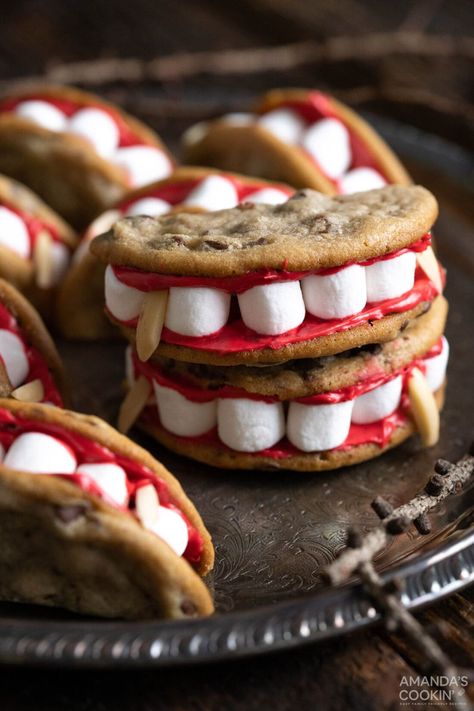 Bloodsucking vampire sandwich cookies are frightfully delicious and super easy to make. Mini marshmallows and slivered almonds are sandwiched between two halves of one chocolate chip cookie bound together with a smear of red frosting! One Chocolate Chip Cookie, Decorated Halloween Cookies, Cute Halloween Cookies, Halloween Chocolate Chip Cookies, Red Frosting, Owl Treats, Diy Decorating Ideas, Halloween Cookies Decorated, Kid Snacks