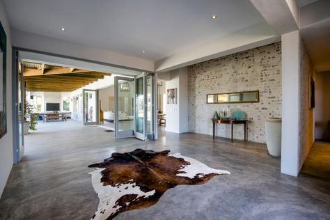 The Pros and Cons of Concrete Flooring | HGTV Cement Floors In House, Cleaning Concrete Floors, Concrete Floors Living Room, Finished Concrete Floors, Seal Concrete Floor, Concrete Floors In House, Heated Concrete Floor, Acid Stained Concrete Floors, Acid Stained Concrete