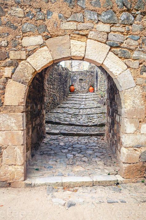 Arch in stone wall of medieval Castle of Leiria Castelo de Leiria building in historical city centre Stone Buildings Old, Medieval Stone Wall, Minecraft Stronghold, Gothic Kingdom, Town Reference, Dungeon Door, Medieval Reference, Ancient Doors, Worldbuilding Ideas