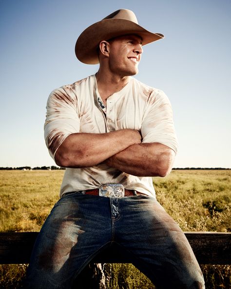 It didn't take long for J.J. Watt to pick up Texas threads, sporting a personalized belt buckle and his own hat.  Prop Styling by Anthony A. Altomare Wardrobe Styling by Michael Nash  Grooming by Juanita Lyon WARDROBE: Henley and Denim: Ralph Lauren Denim & Supply; Belt: Black Jack available at Cavender’s; Hat and Belt Buckle: Watt’s Own Mounting A Horse, J. J. Watt, Jj Watt, Wilde Westen, Cowboy Up, Cowboy Outfits, Country Men, Ralph Lauren Denim, Denim And Supply